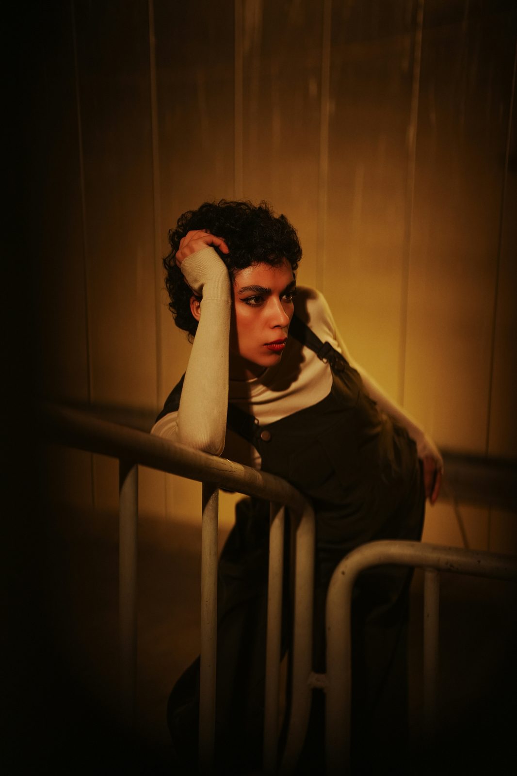 A figure in warm amber light